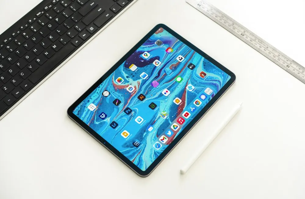 black ipad on white table