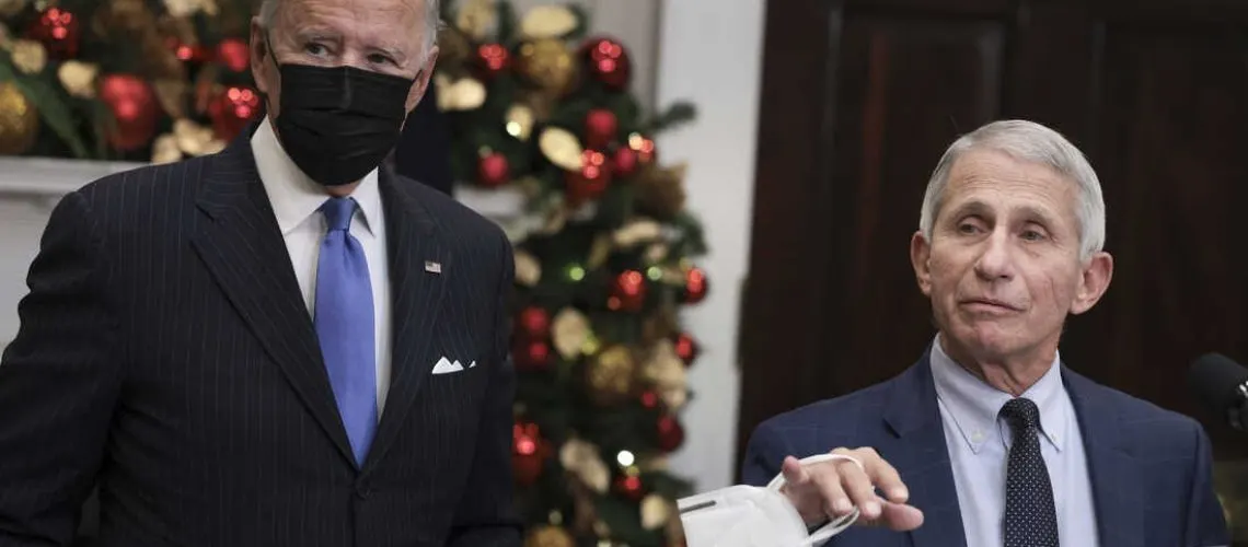 WASHINGTON, DC - NOVEMBER 29: Anthony Fauci (R), Director of the National Institute of Allergy and Infectious Diseases and Chief Medical Advisor to the President, speaks alongside U.S. President Joe Biden as he delivers remarks on the Omicron COVID-19 variant following a meeting of the COVID-19 response team at the White House on November 29, 2021 in Washington, DC. The World Health Organization designated it a variant of concern after South African officials discovered the variant last week. (Photo by Anna Moneymaker/Getty Images)
