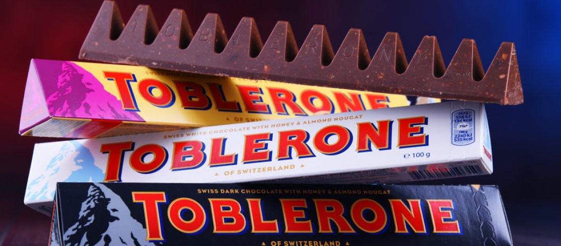 POZNAN, POL - MAR 22, 2019: Three bars of Toblerone, a Swiss chocolate brand owned by US confectionery company Mondelez International, Inc.