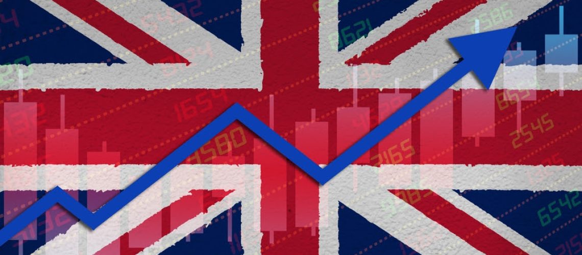 3D rendering of economic recovery with stock market chart arrow up in positive territory over UK flag painted on wall. Business and financial money market upturn concept in United Kingdom.